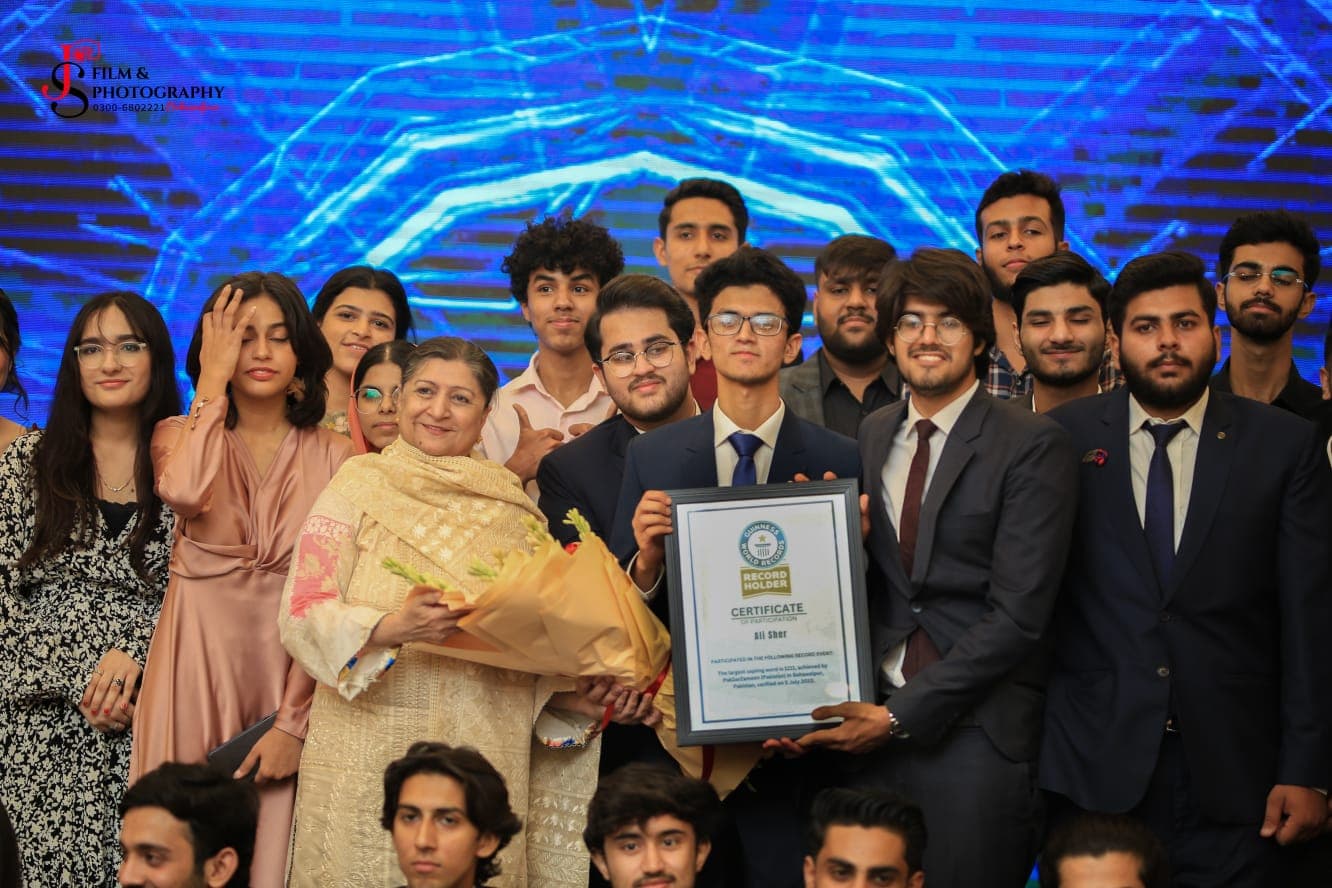 Volunteers and saplings arranged during the record-setting environmental initiative.